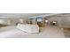 Open-concept living area with a stone fireplace, comfortable seating, and access to the outdoors at 1005 Renfroe Lake Dr, Auburn, GA 30011