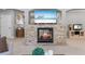 Living room with stone fireplace, TV, arched entryways and open floorplan for entertaining and relaxation at 1005 Renfroe Lake Dr, Auburn, GA 30011