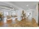 Open concept living area with hardwood and tile floors, coffered ceiling and views to other rooms at 1005 Renfroe Lake Dr, Auburn, GA 30011