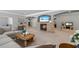 Comfortable living room with a stone fireplace, large sofa, and access to other living areas at 1005 Renfroe Lake Dr, Auburn, GA 30011