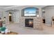 Inviting living room with a stone fireplace, a TV, and an open floor plan for modern living at 1005 Renfroe Lake Dr, Auburn, GA 30011
