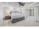 An elegant main bedroom with a tray ceiling, fan, and plenty of natural light at 1005 Renfroe Lake Dr, Auburn, GA 30011