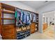 Walk-in closet featuring custom shelving with access to the bathroom at 1005 Renfroe Lake Dr, Auburn, GA 30011