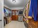 Spacious walk-in closet featuring custom shelving and ample storage at 1005 Renfroe Lake Dr, Auburn, GA 30011