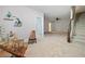 Spacious living room with neutral paint, plush carpet, and decorative seating area at 2801 Avington Se Ln, Smyrna, GA 30080