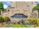 Stone entrance sign 'Towns at Breton Ridge' with landscaped garden at 2801 Avington Se Ln, Smyrna, GA 30080
