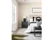 A well-lit bedroom showcasing modern decor, a plush bed, and an elegant nightstand with a stylish lamp at 2813 White Oak Ln, Decatur, GA 30032