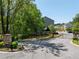 Gated townhome community entrance with manicured landscaping and signage at 2813 White Oak Ln, Decatur, GA 30032