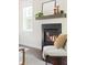 Living room with a modern fireplace, mantle, and tasteful decor creating a cozy and inviting atmosphere at 2813 White Oak Ln, Decatur, GA 30032
