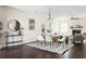 Open-concept living and dining area with hardwood floors, fireplace, and neutral decor at 2813 White Oak Ln, Decatur, GA 30032