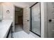Bathroom with a glass shower and an open door at 5525 Belle Meade Dr, Villa Rica, GA 30180
