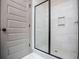 Modern bathroom features a sleek glass shower with white tile surround and built-in niche at 5525 Belle Meade Dr, Villa Rica, GA 30180