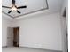 Bedroom with a tray ceiling and ceiling fan at 5525 Belle Meade Dr, Villa Rica, GA 30180