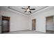 Bedroom with two doors, neutral carpet, and a ceiling fan at 5525 Belle Meade Dr, Villa Rica, GA 30180