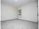 Bedroom with neutral paint and carpet with a view to trees outside the window at 5525 Belle Meade Dr, Villa Rica, GA 30180