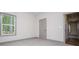 Bedroom with large window and neutral colors, offering a calming and comfortable atmosphere at 5525 Belle Meade Dr, Villa Rica, GA 30180