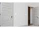 Hallway with gray trim and doors with dark hardware at 5525 Belle Meade Dr, Villa Rica, GA 30180
