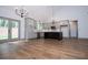 Well-lit open kitchen with granite counters, stainless appliances and a dark island at 5525 Belle Meade Dr, Villa Rica, GA 30180