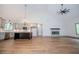 Large living space with open floor plan, kitchen island, and modern fireplace at 5525 Belle Meade Dr, Villa Rica, GA 30180