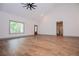 Spacious living room with hardwood floors, high ceilings, a fan and plenty of natural light at 5525 Belle Meade Dr, Villa Rica, GA 30180