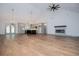 Expansive open concept living area with modern fireplace and open kitchen island for easy entertainment at 5525 Belle Meade Dr, Villa Rica, GA 30180