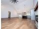 Bright living room with hardwood floors, modern lighting, and open to the kitchen at 5525 Belle Meade Dr, Villa Rica, GA 30180