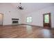 Beautiful living room with fireplace and large windows that offer plenty of natural light at 5525 Belle Meade Dr, Villa Rica, GA 30180