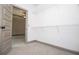 Spacious walk-in closet with wire shelving and neutral carpeting at 5525 Belle Meade Dr, Villa Rica, GA 30180