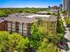 Beautiful red brick apartment building with manicured trees and balconies at 850 Piedmont Ne Ave # 1206, Atlanta, GA 30308