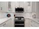 Modern kitchen featuring white cabinets, a subway tile backsplash, and stainless steel appliances at 850 Piedmont Ne Ave # 1206, Atlanta, GA 30308
