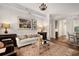 Bright living room featuring hardwood floors, elegant furnishings, and an open layout to the kitchen at 850 Piedmont Ne Ave # 1206, Atlanta, GA 30308