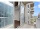 Balcony with railing overlooking the city, accessible from the bedroom at 855 Peachtree Ne St # 2205, Atlanta, GA 30308