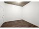 Empty bedroom boasts a concrete ceiling, hard floors and a white closet at 855 Peachtree Ne St # 2205, Atlanta, GA 30308