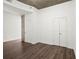 Neutral bedroom features hard floors, two large white closets and concrete ceiling at 855 Peachtree Ne St # 2205, Atlanta, GA 30308