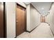 Hallway with carpet flooring and neutral-colored walls and doors at 855 Peachtree Ne St # 2205, Atlanta, GA 30308