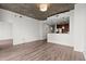 Open living space with hardwood floors and views to kitchen area at 855 Peachtree Ne St # 2205, Atlanta, GA 30308