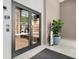 Viewpoint Private Residences front entrance with glass doors, plants, and modern design at 855 Peachtree Ne St # 2205, Atlanta, GA 30308