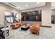 Comfortable lounge area featuring leather chairs, modern art, and a sleek entertainment center at 855 Peachtree Ne St # 2205, Atlanta, GA 30308