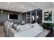 Contemporary lounge area with a large sectional sofa, media center, and stylish decor at 855 Peachtree Ne St # 2205, Atlanta, GA 30308