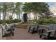 Serene outdoor space with modern lounge chairs and a tranquil water feature surrounded by lush landscaping at 855 Peachtree Ne St # 2205, Atlanta, GA 30308