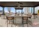 Outdoor cooking area features a built-in grill, a pergola and counter seating with city views at 855 Peachtree Ne St # 2205, Atlanta, GA 30308