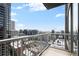Stunning city view from the condo's balcony with a white railing at 855 Peachtree Ne St # 2205, Atlanta, GA 30308