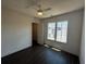 Bedroom features hardwood floors, ceiling fan and a window with natural light at 962 Bibbs Circle Nw # 6, Atlanta, GA 30318