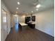 View of the open concept kitchen with an island, modern appliances, and stylish flooring at 962 Bibbs Circle Nw # 6, Atlanta, GA 30318