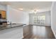 Living Room featuring open floor plan with hardwood floors and modern kitchen at 4333 Dunwoody Park # 1211, Atlanta, GA 30338