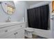 Well-maintained bathroom featuring a single sink vanity and a shower-tub combo at 2711 Bluffton Rd, Buford, GA 30519