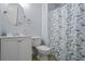 Bathroom with butterfly shower curtain, round mirror, and white vanity offering a fresh and stylish space at 2711 Bluffton Rd, Buford, GA 30519