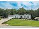 Charming single-story home with a well-manicured lawn and a driveway leading to an attached garage at 2711 Bluffton Rd, Buford, GA 30519