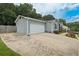 Spacious attached garage with ample parking, connected to the house with a wide driveway at 2711 Bluffton Rd, Buford, GA 30519