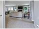 Open-concept living room with a cozy fireplace and view of dining area at 2711 Bluffton Rd, Buford, GA 30519